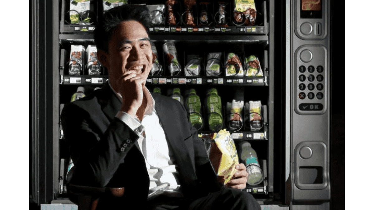 Employee having a healthy snack from a smart office vending machine