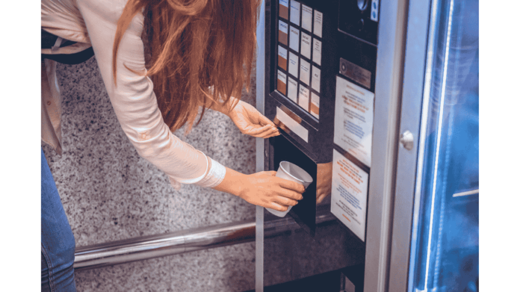 Staff retrieving drinks from a modern vending machine