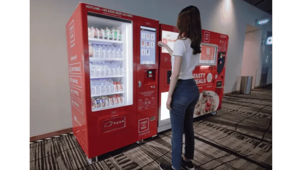 Traveler buying snacks from vending machine