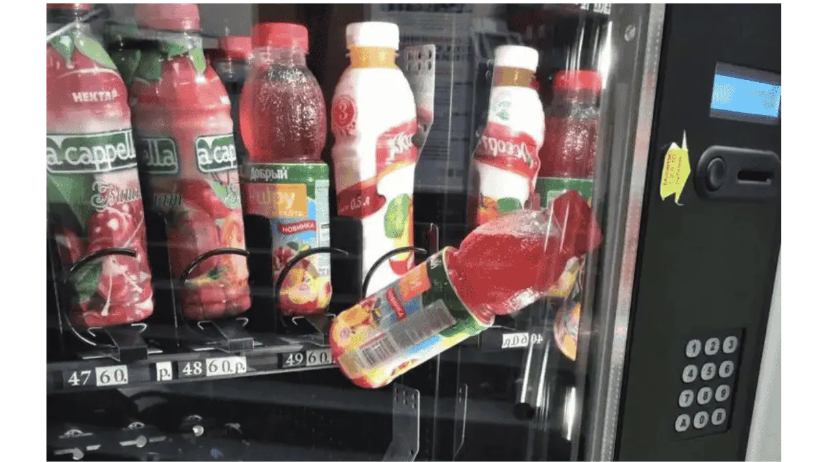 a bottle of drink stuck in vending machine
