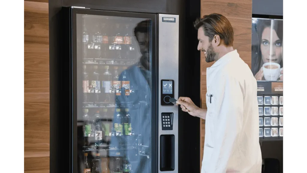 employee purchasing product from a vending machine