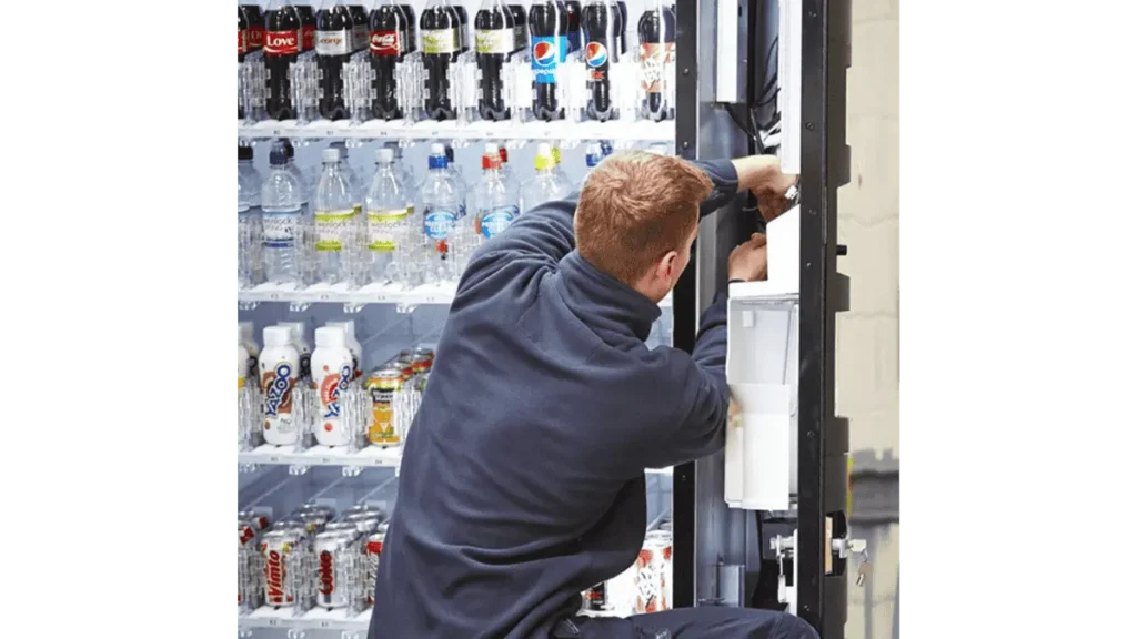 vending machine technician performing maintenance