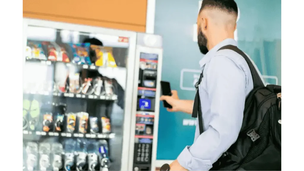 User scanning QR to purchase item from vending machine